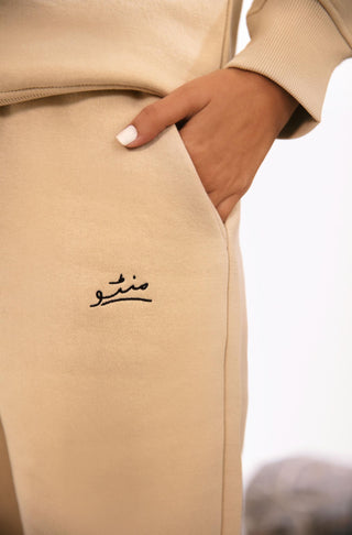 Shopmanto UK, Pakistani urdu calligraphy clothing brand manto UK ready to wear one piece french vanilla jogger track pants, sweatpants