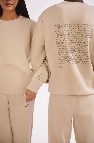 Manto, Most Comfy Ready to Wear Unisex Triple Layered Premium Fleece French Vanilla Talaash Sweatshirt with Urdu Calligraphy of Poetry by Nida Fazli Paired with French Vanilla Jogger Pants